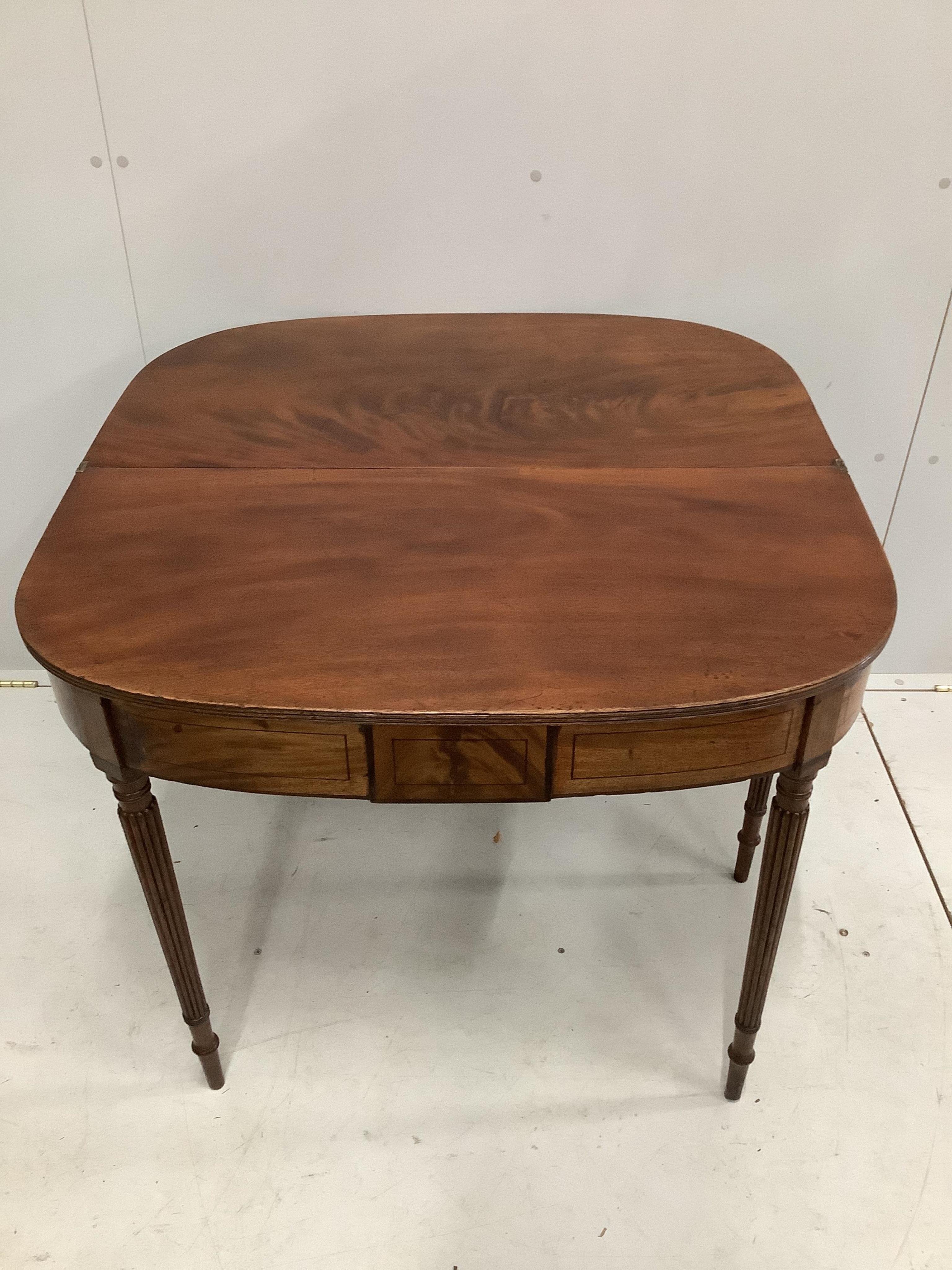 A George III mahogany D shaped folding tea table, width 91cm, depth 45cm, height 71cm. Condition - good